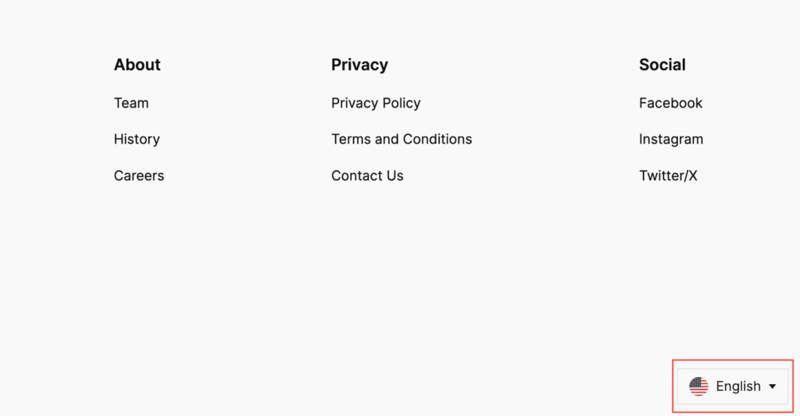 Eine Website-Fußzeile mit dem Sprachumschalter in der unteren rechten Ecke, die eine Flagge und die Beschriftung Englisch anzeigt